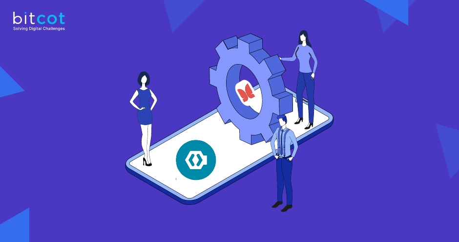 a group of people standing next to a gear